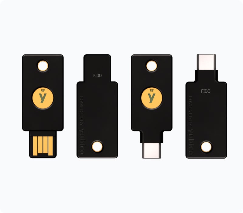 Ilustrasi YubiKey — Migrasi SMS OTP ke Security Key: Alasan & Tahapannya